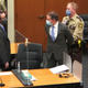 Former Minneapolis Police Officer Derek Chauvin, center, is taken into custody as his attorney, Eric Nelson, left, looks on after the verdicts were read at Chauvin’s trial for the 2020 death of George Floyd, at the Hennepin County Courthouse in Minneapolis, April 20, 2021.